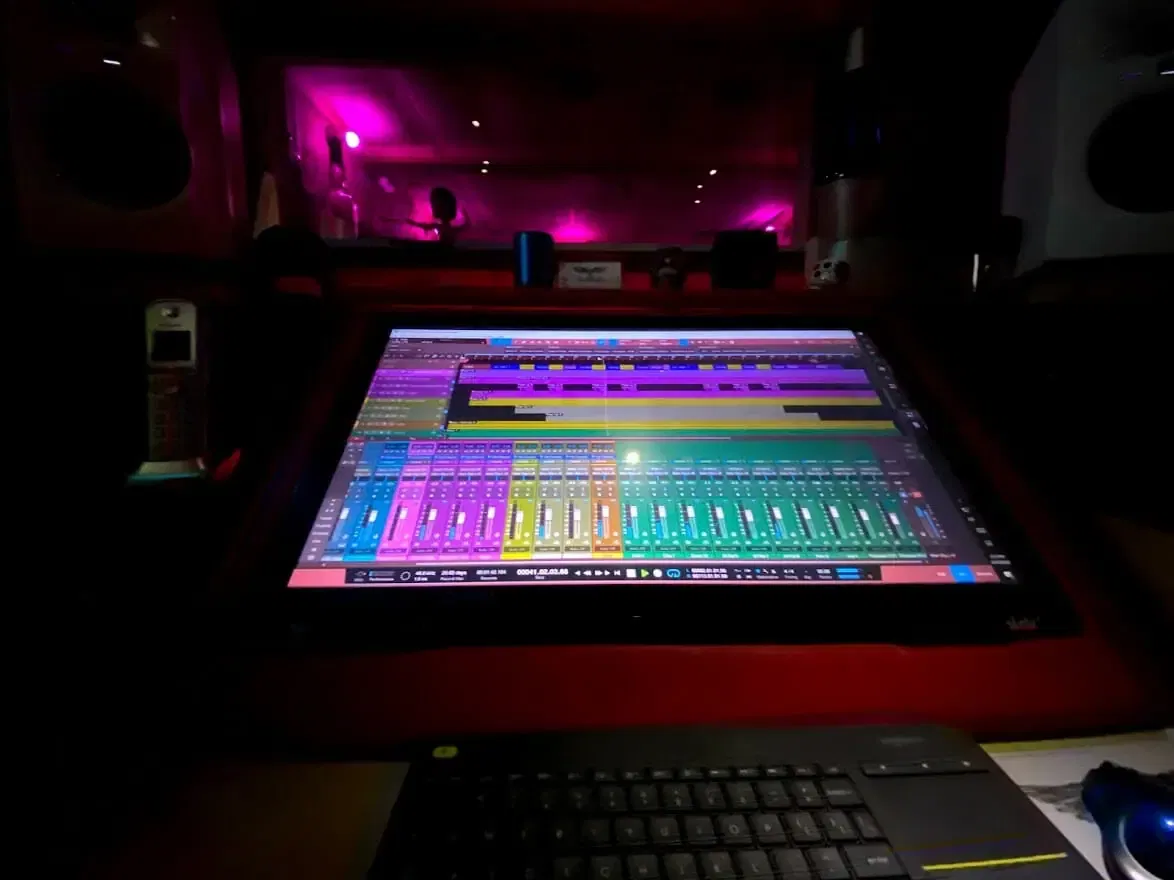 Digital audio workstation screen illuminated in the dimly lit MOON MUTT Recording Studio in Roswell, New Mexico. | MOON MUTT Recording Studio